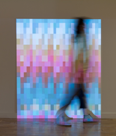 Musical Sweater for the Blue Whale, Portland State University Littman Gallery, 2013. As the digital sweater is woven from left to right, the red, green, and blue color values of each pixel are translated to produce the accompanying musical score. The projected surface measures five feet in height, which relates to the approximate height of the human body.  At this size, when complete, the sweater is large enough to wrap the circumference of a blue whale, the largest creature known to exist.