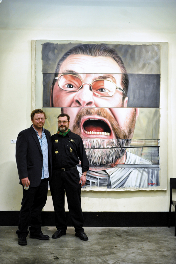 Left to right: Painter Jason Coatney with artist Zack Kosta in front of Coatney’s painting of Kosta.