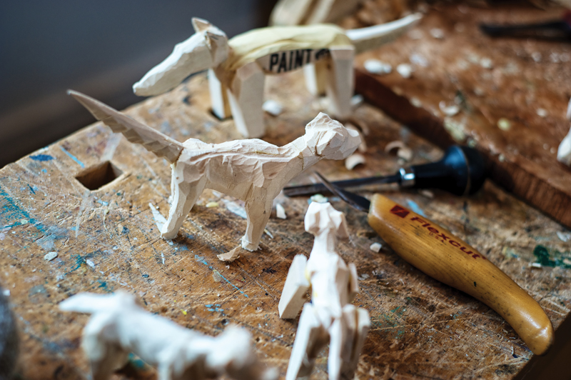 "Rescue Dogs" in the works. These figures are made from scraps in Peterson’s studio. The idea is to carve dogs small enough that they can fit in one’s hand. Photo by Miri Stebivka. 