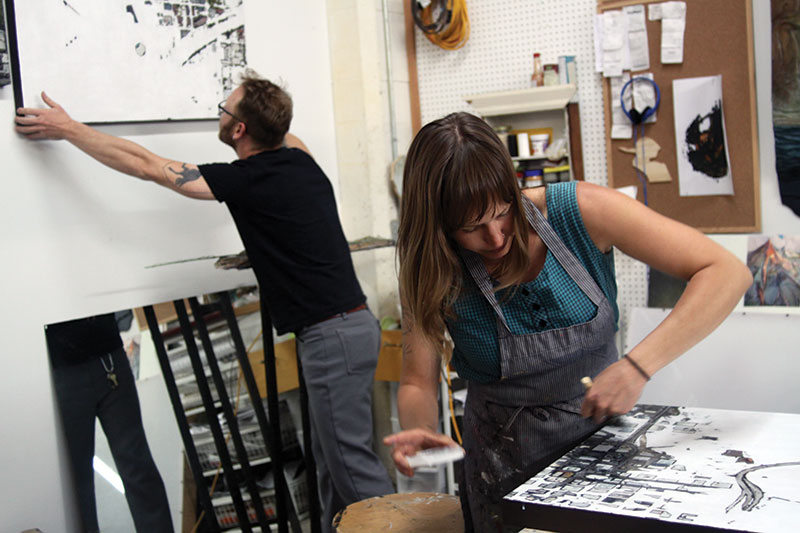Artists Tyler Corbett and Erinn Kathyrn working in their studio Friday, May 2, 2014. Photograph by Mary Locke.